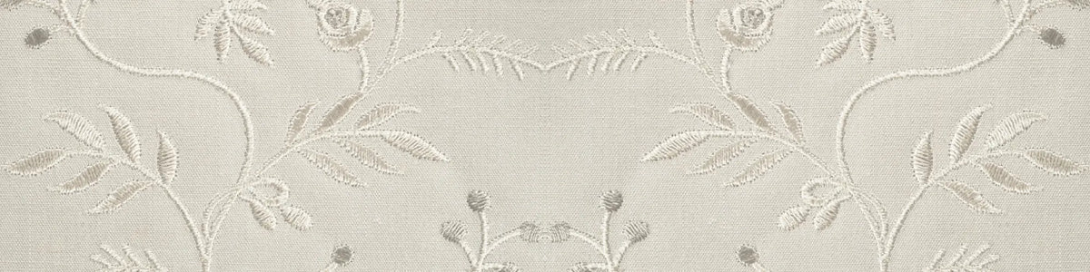 Cream embroidered fabric with botanical leaves and floral vines for the AOKINSIDE Season Nine botanical jewelry collection.